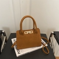 Chic brown matte leather handbag with metallic buckle and adjustable shoulder strap - Brown