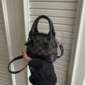 Mini canvas leather crossbody bag featuring vintage triumph pattern and brown accents - Black and Brown