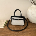Borsa a tracolla da donna in pelle nera e tela bianca con cuciture e cinturino - Nero