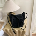 Detail of vintage black bucket bag featuring contrast white stitching and adjustable strap - No Pendant / Black