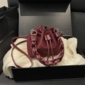 Burgundy suede bucket bag with woven handle and drawstring closure in luxury black gift box - Red