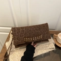 Minimalist leopard print envelope clutch bag with gold rivets and wrist strap for winter fashion - Brown