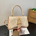 Chic beige crossbody bag with embossed graffiti pattern and gold buckle detail - Khaki