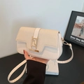 Minimalist beige crossbody bag with textured flap and golden geometric metal buckle - White