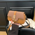 Chic two-tone shoulder bag in camel leather with woven texture and gold metal buckle - Brown