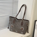 Detail of grey vintage tote bag with cat pattern, brown handles and metal buckles - Gray