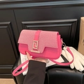 Chic rose red crossbody bag with red and white woven flap and gold geometric clasp - Pink