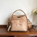Champagne gold waterproof nylon crossbody bag with top handle and adjustable strap - Khaki