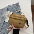Minimalist khaki nylon crossbody bag with adjustable strap and front metal logo detail - Khaki