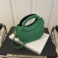 Sparkly lime green crescent crossbody bag with integrated round handle and gold hardware - Green