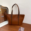 Brown leather tote bag with dark handles and reinforced V-shaped stitching detail - Brown