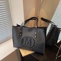 Large dark grey monogram tote bag with leather handles and metallic M logo detail - Black