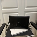 Minimalist black leather envelope clutch bag with dark metallic horseshoe buckle - Black
