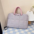 Detail of lavender quilted puff tote with pink handles and triangle zip puller - Grey Small