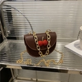 Dark brown saddle bag with rhinestone cherry charm and gold chain strap handle - Brown