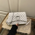 White mini crossbody bag with grey M letter print and silver metal chain strap - White