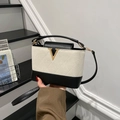 Chic black and white quilted crossbody bag with gold V-metal hardware and leather strap - White