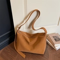 Minimalist caramel brown matte leather tote bag with a wide adjustable shoulder strap - Brown
