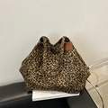 Large leopard print canvas tote bag with brown leather trim and wide shoulder straps - Brown