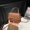 Chic tan brown PU leather mini flap bag with wavy cut design and top handle - Brown