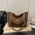 Dark brown suede tote bag with golden deer pendant and elegant chain strap detail - Brown