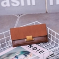 Brown long wallet for women featuring matte patchwork finish and golden square buckle - Tan