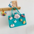 Light green felt tote bag for kids with cute cartoon patches on a wooden hanger - Lake Blue