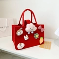 Red felt tote bag for kids featuring cute plush bunny and carrot charms with sturdy handles - Red