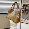 Straw tote bag featuring white lace ribbon bow and adjustable khaki shoulder strap - Khaki