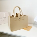 Minimalist beige felt tote bag with reinforced handles and snap closure in a modern setting - Khaki