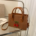 Brown woven straw crossbody bag featuring cute cherry accents and adjustable strap - Dark Brown