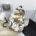 Graffiti print backpack in beige with blue and black details for street style fashion - Khaki