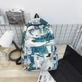 White urban backpack with graffiti print featuring blue abstract patterns and front pocket - Green