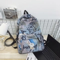 Blue graffiti print backpack with waterproof nylon and urban art typography - Blue