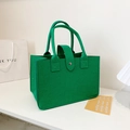 Green felt tote bag with metal snap closure and sturdy handles in a minimalist design - Dark Green