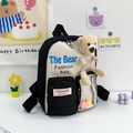 Mochila infantil bicolor negro y beige con oso de peluche y diseño moderno de contraste - Negro