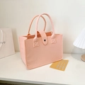 Light pink felt tote bag with snap closure and dual handles in minimalist style - Pink