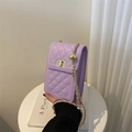 Detail of purple quilted leather phone bag featuring a gold chain strap and metal lock - Purple