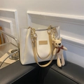 Macro shot of off-white PU leather tote bag with metal chain and small bear charm - Khaki (No Pendant)
