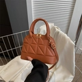 Caramel brown quilted shell bag with gold hardware and adjustable crossbody strap - Dark Brown