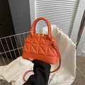 Fashionable orange quilted shell crossbody bag with golden hardware and stitch details - Orange Red