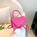 Bright pink embossed crocodile leather handbag with elegant gold metal trim and top handle - Rose Red