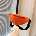 Close-up of orange faux crocodile skin chest bag with gold zipper and woven strap - Orange Red