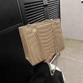 Beige faux leather crossbody bag featuring wave quilted stitching and a gold chain strap - Khaki