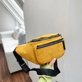 Detail shot of yellow corduroy crossbody waist bag with adjustable black nylon strap - Yellow