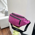 Detail of the rose purple corduroy texture and dual zipper design on the waist bag - Purple