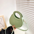 Minimalist light green PU leather round crossbody bag with vertical pleats and cutout handle - Green