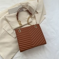 Brown quilted leather shoulder bag with gold chain strap and elegant V-stitch pattern - Brown