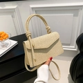 Chic beige woven crossbody bag with stylish knot handle and envelope flap design - Khaki