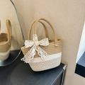 Handwoven two-tone straw basket bag featuring a large decorative white lace bow - Khaki And Satin Scarf